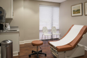 Exam room in a Baby + Co health and wellness building designed by SGA Design Group.