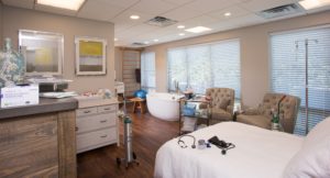 Guest room of a Baby + Co health and wellness designed by SGA Design Group.