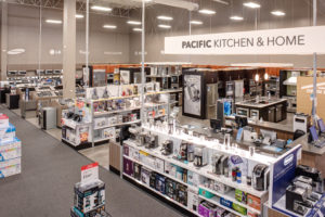 Best Buy shelves of appliances inside building architecture by SGA Design Group.