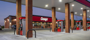 Gas pumps in front of Casey’s General convenience store designed by SGA Design Group
