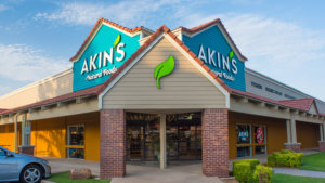 Front entrance of an Akins Natural Foods grocery store.