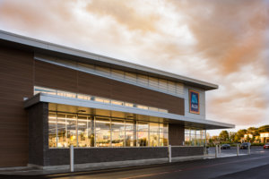 The exterior of an Aldi Food Market architectural design by SGA Design Group.