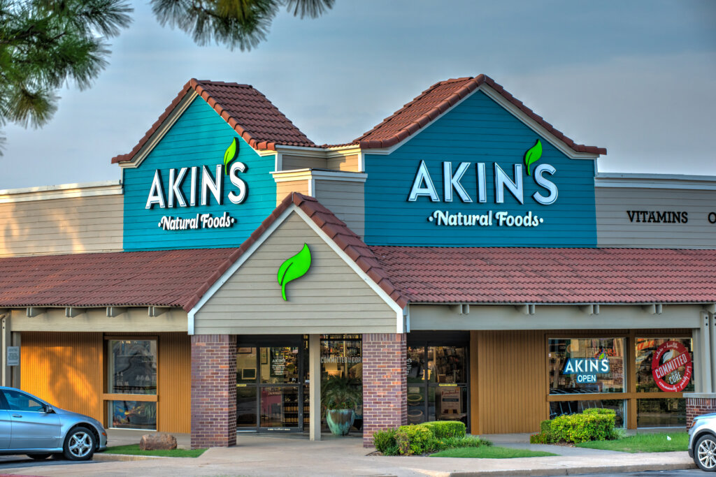 Exterior of an Akins Natural Foods grocery store building designed by SGA Design Group.